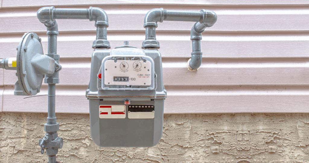 A gas meter attached to the side of a building.