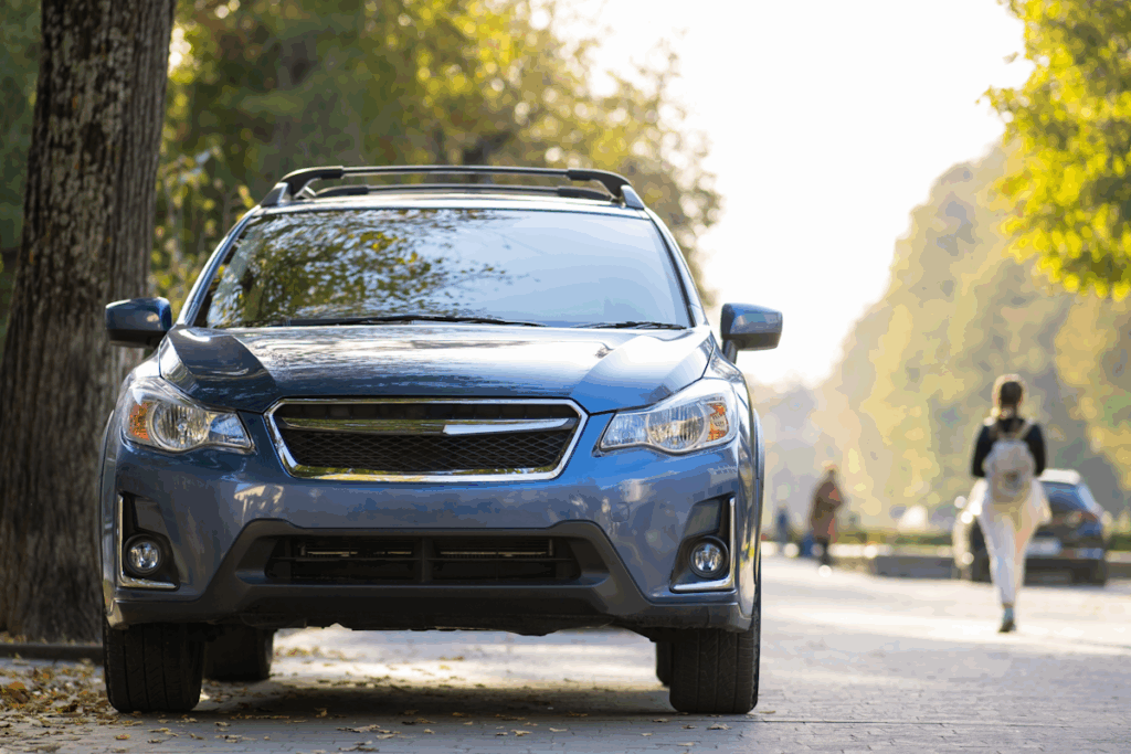 A car driving down a residential street.